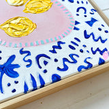 Lemons In Pink Bowl On Blue