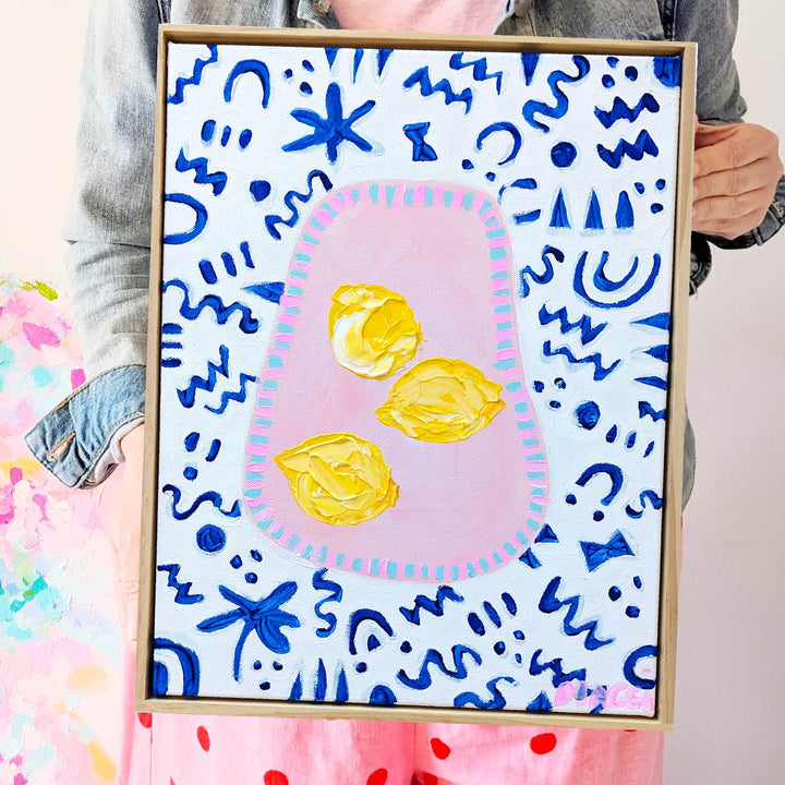 Lemons In Pink Bowl On Blue